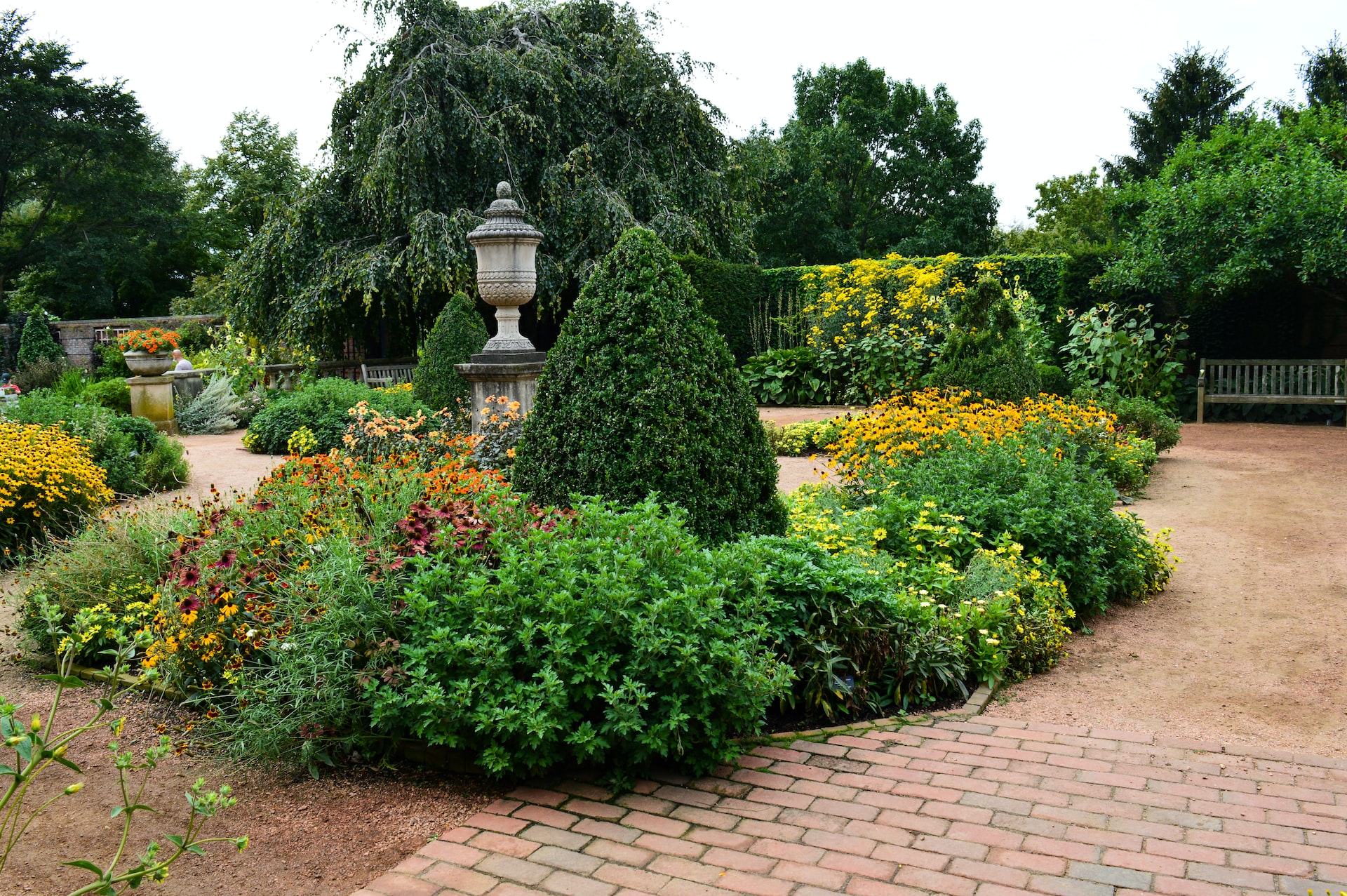 Landscape featuring pavers and curbing